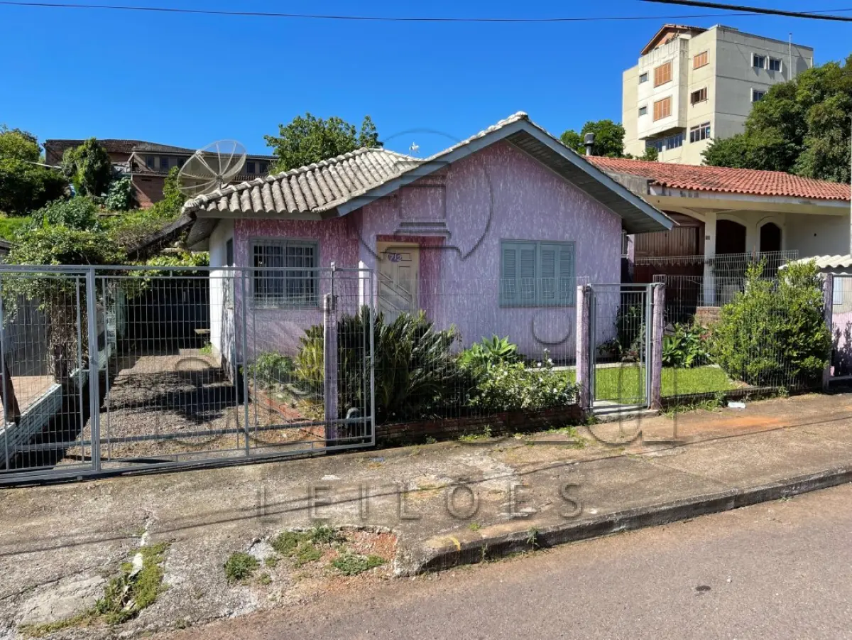 LOTE 002 - Área de 349,44m², contendo um prédio residencial em alvenaria com 60,21m² e outra edificação aos fundos do terreno, localizado na Rua André Edy Eidelwein, nº 712, bairro Imigrantes, Estrela/RS
