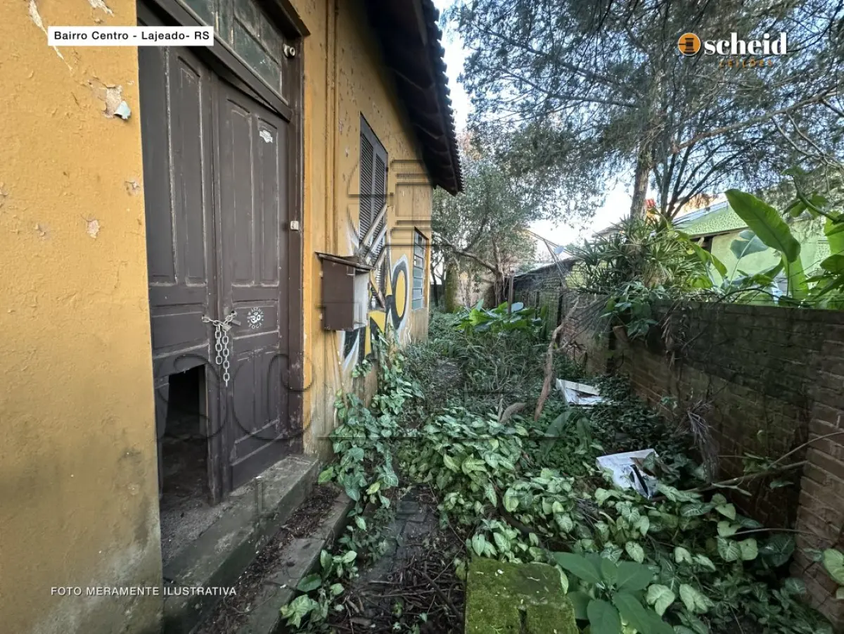 LOTE 001 - Área de 490,23m², contendo uma casa residencial de alvenaria com 77,00m², um galpão de madeira com 11 50m² e um telheiro de madeira com 21,00m², localizado na Rua Pinheiro Machado, nº 198, bairro Centro, Lajeado/RS