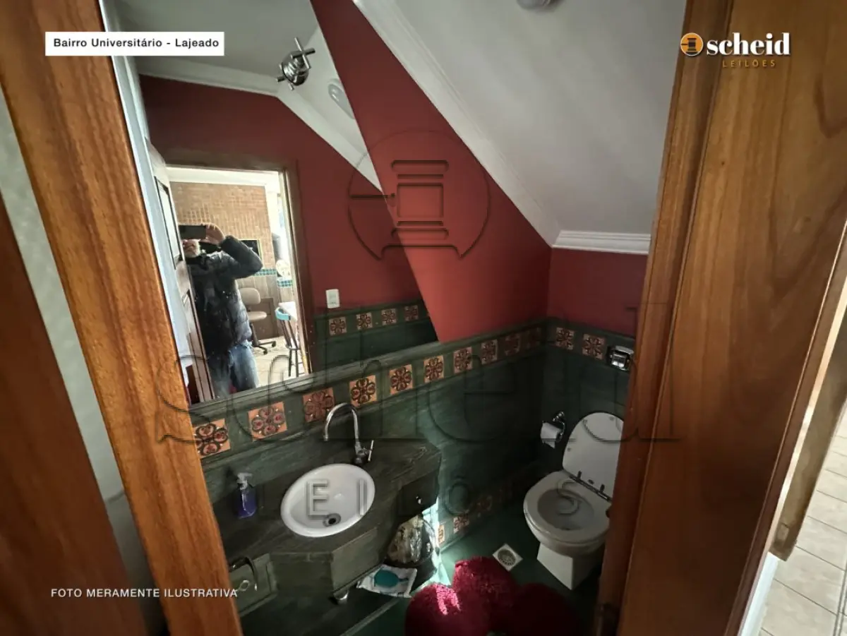 LOTE 001 - Área de 1.804,92m², contendo um prédio de alvenaria de dois pavimentos, medindo 62,34m² o pavimento inferior e 177,78m² o pavimento superior, situado à Rua Sabiá, n° 48, bairro Universitário, Lajeado/RS